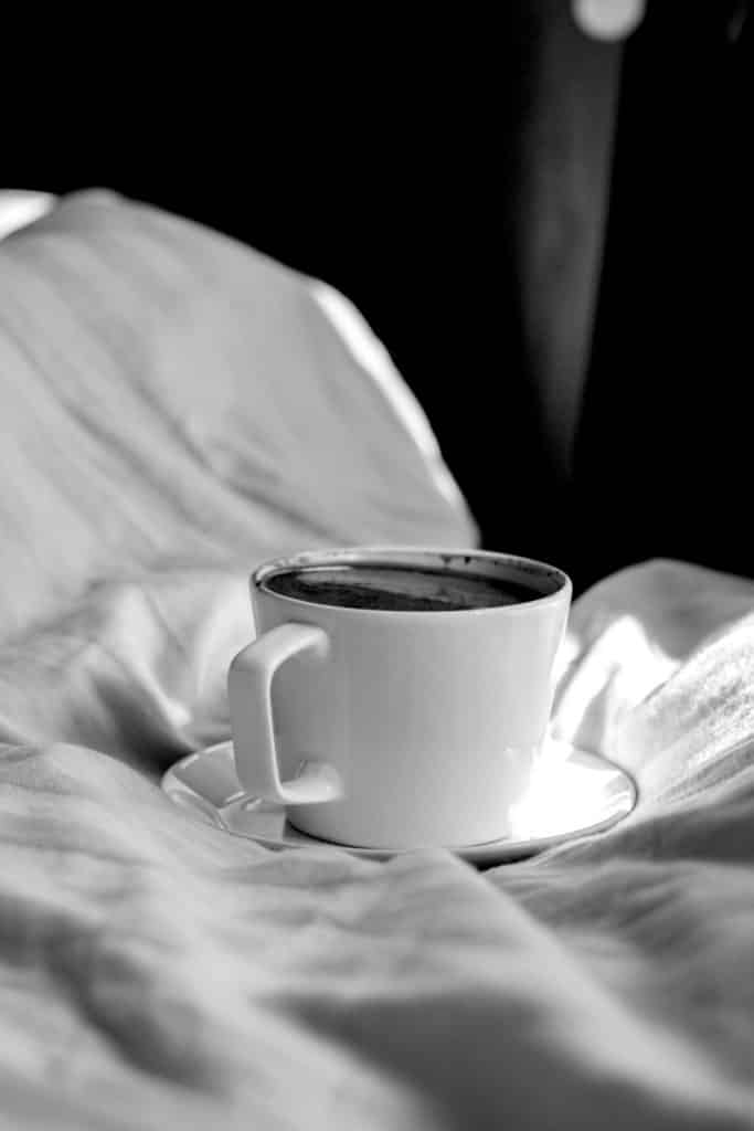 cup of coffee in bed