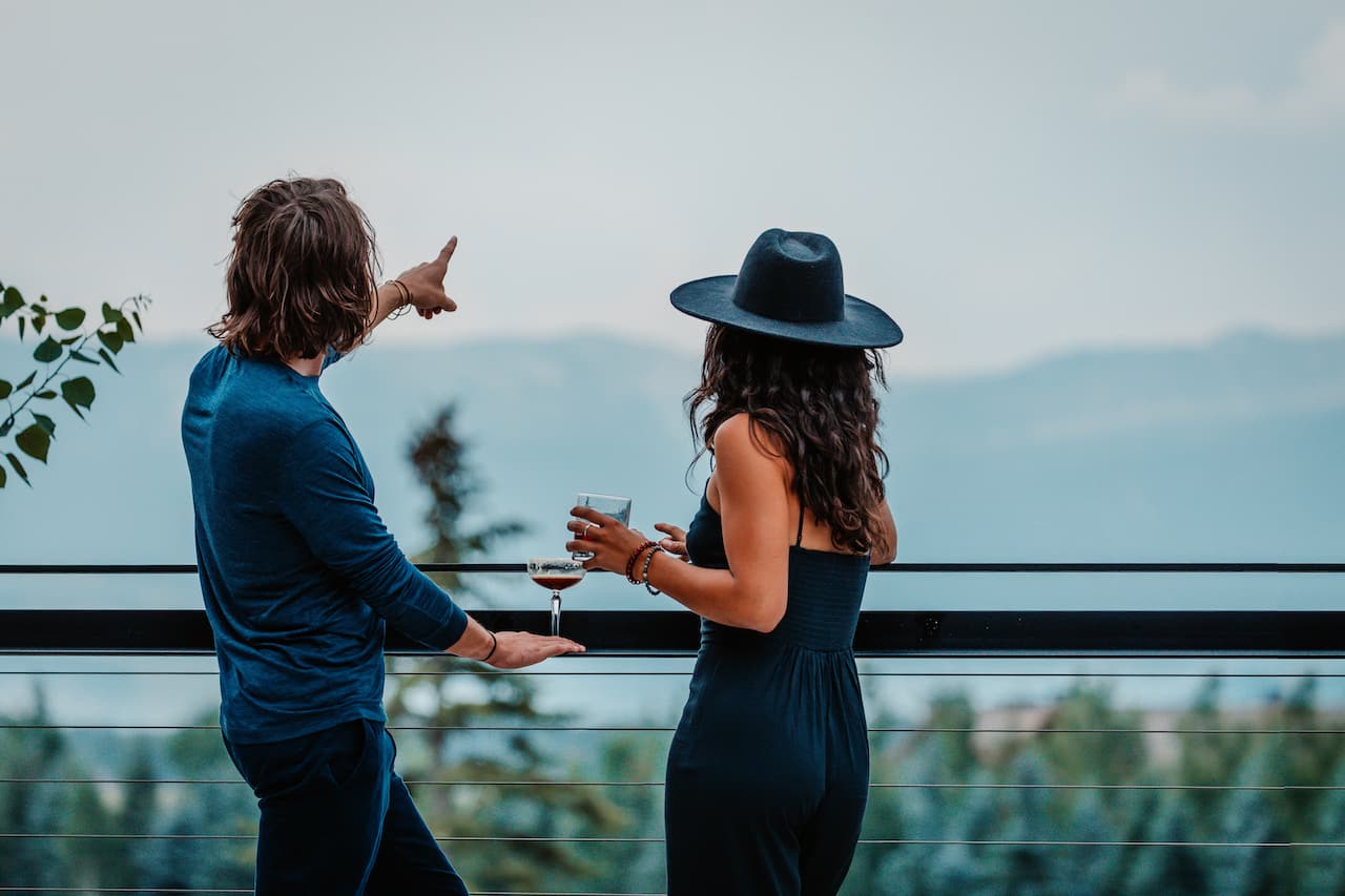 2 people enjoying a vantage point from the deck