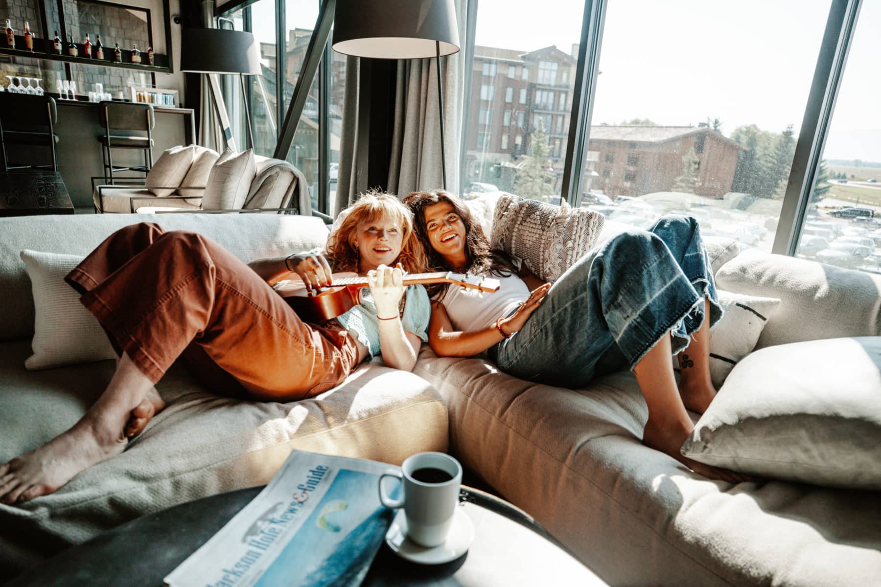 Two people lounging on the couch