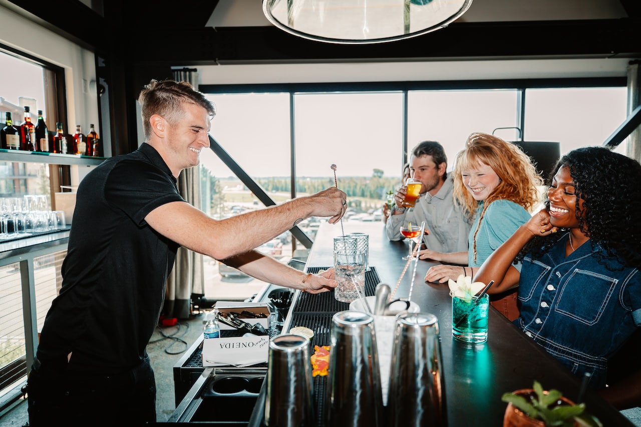 Bartender mixing drink at Continuum bar