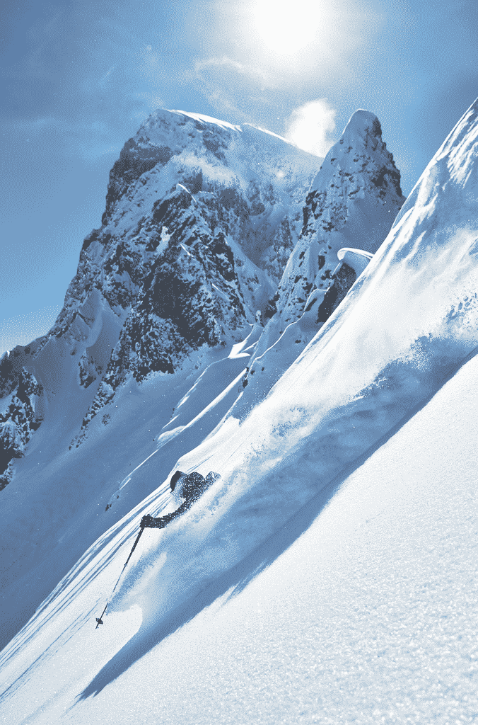 Skier carving down the mountain