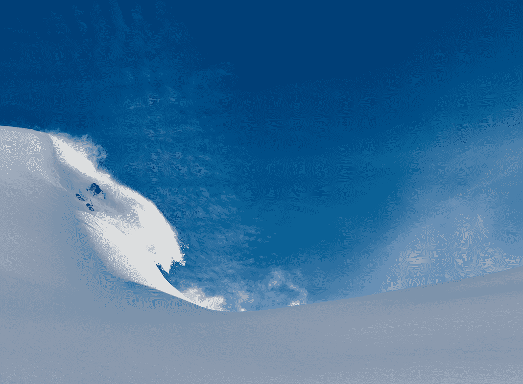 mountain covered with snow and a blue sky background
