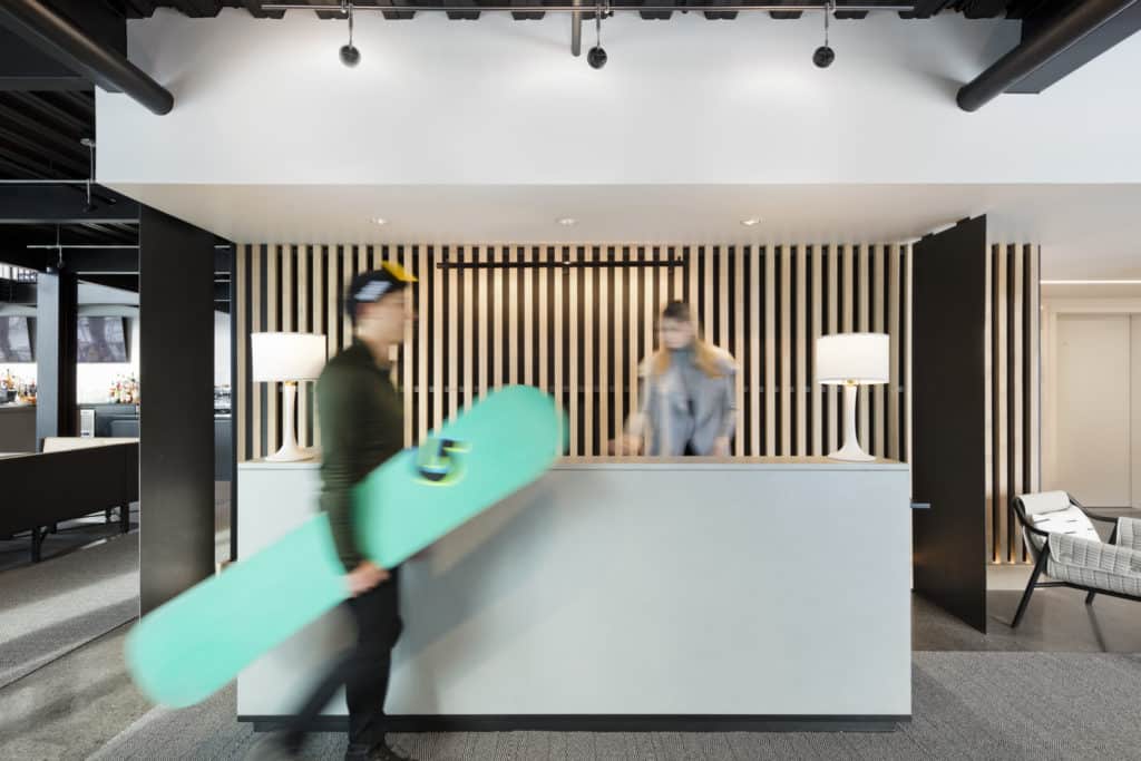 Snowboarder checking in at front desk