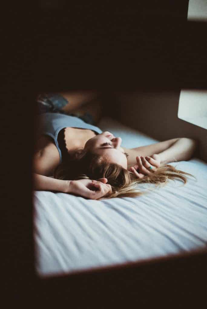 person relaxing in bed