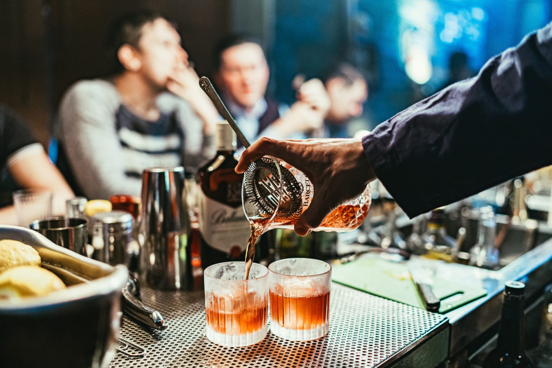 bartender pouring cocktails
